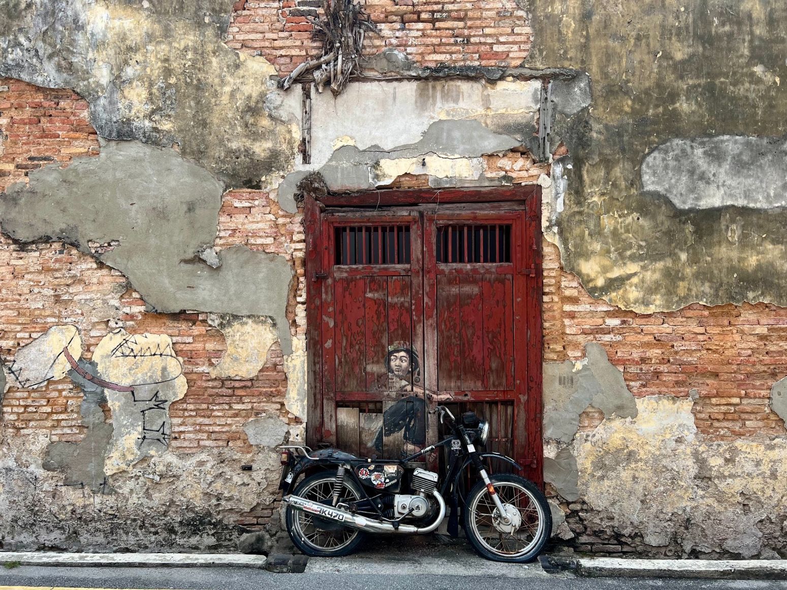 Boy on a motorbike, mural, wall painting in Georgetown, Penang, Malaysia