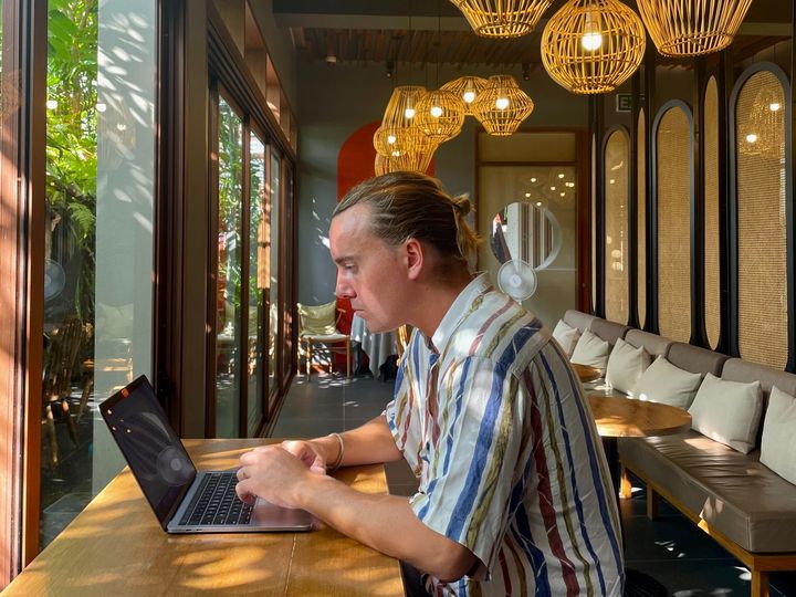 Izaac working on his laptop in Orb Cafe, Chiang Mai, Thailand.Digital Nomad. 